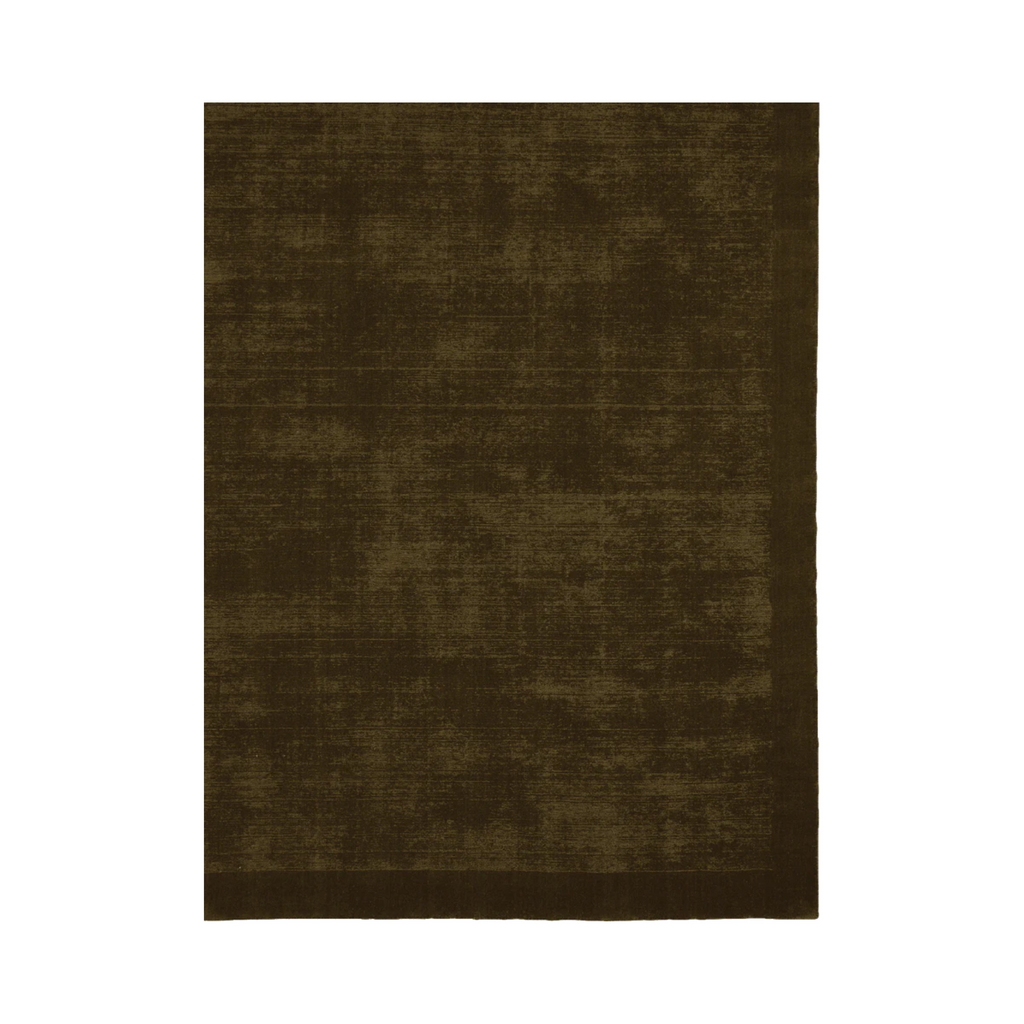 The Tait rug -  olive, by Tribe Home handloomed in a deep green hue, with New Zealand wool for comfort and durability. 