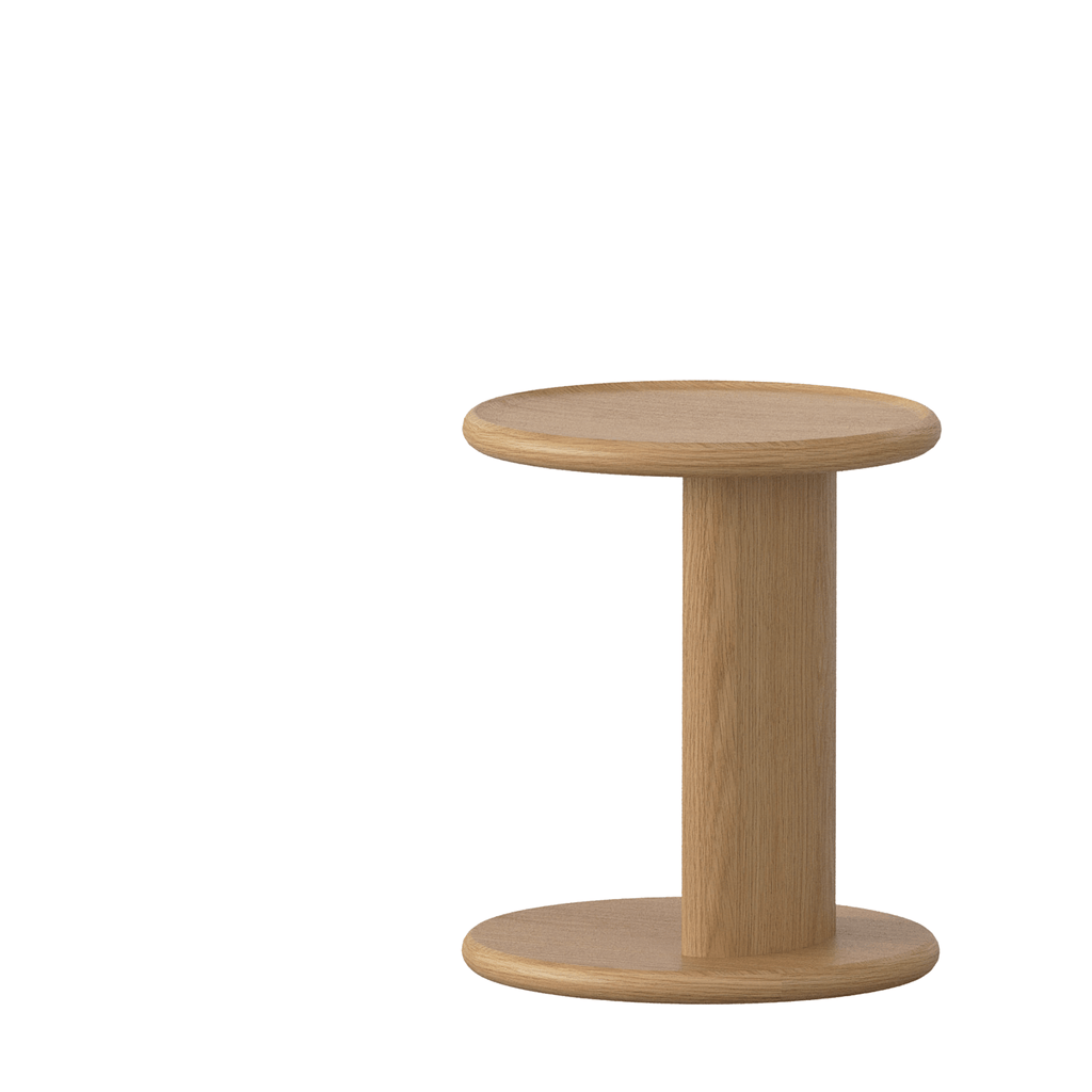 MIA 330 oak side table in natural finish beside sofa.