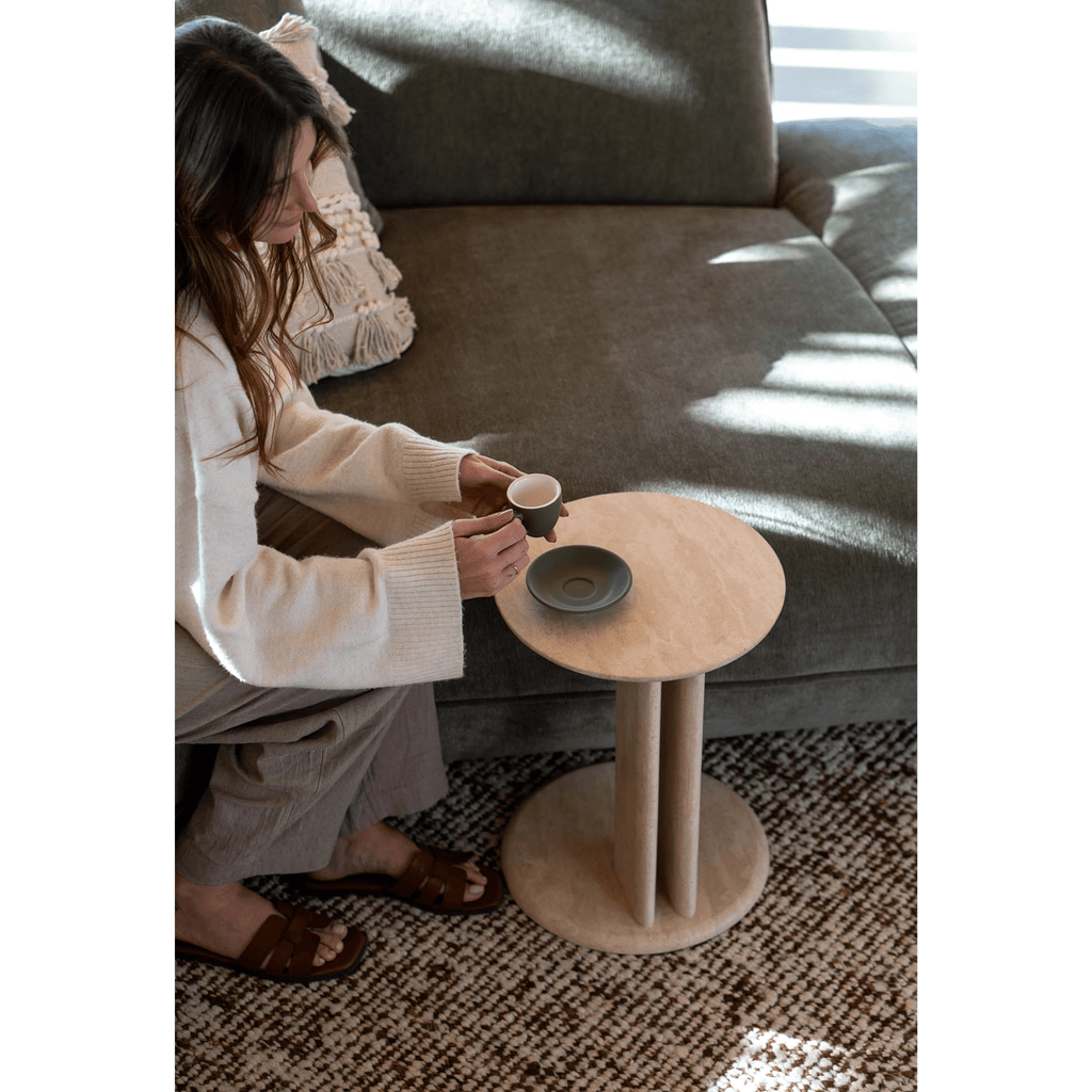 Master Pacific Travertine Roquette Side Table styled in minimalist living room.