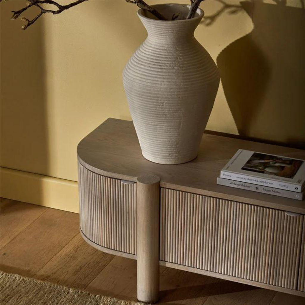 A modern design by Globewest, the Artie Ripple Entertainment unit offering ample storage with a textured ripple finish.  Crafted from Ash Veneer with Solid Ash Dowels, and a sealed whitewash finish.