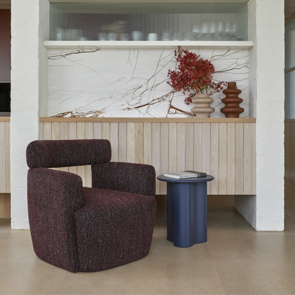 The Artie wave side table is the perfect mix of sculptural and modern design, with a ash veneer finish. 