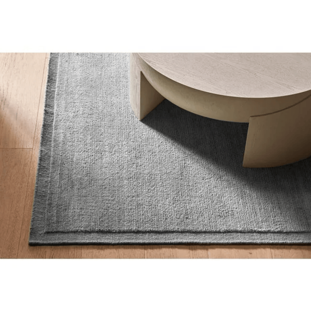 GlobeWest Bower Frame Rug – Orion Grey: sophisticated mid‑tone colour in framed wool weave, offering depth and stylish nuance.  Available in Perth at Granite Lane in Osborne Park