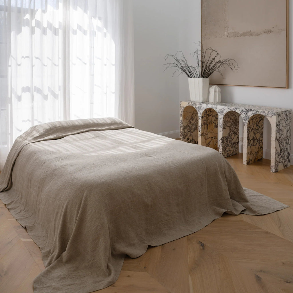 Eadie Lifestyle Luca Linen Bed Cover in Natural beige draped elegantly on a bed