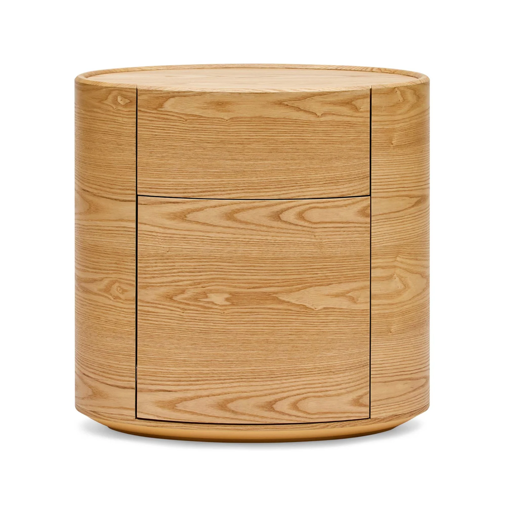 Finn Oval Bedside in natural ash — bedside table ashowing smooth curved edges and drawer handles.