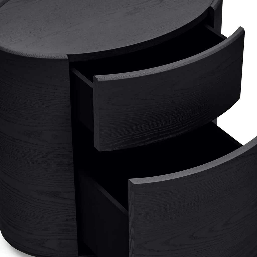 Finn Oval Bedside black— close-up of timber grain and oval bedside table profile with drawers open