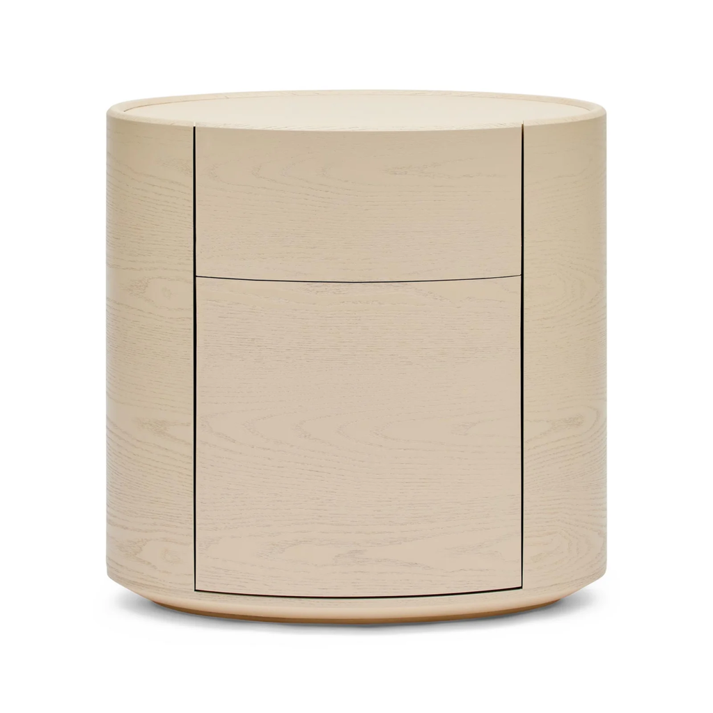 Finn Oval Bedside parchment — close-up of timber grain and oval bedside table profile with drawers closed.