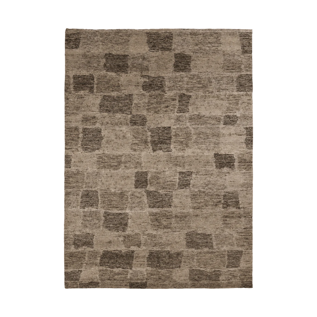 Our Flagstone Rug from Tribe Home features a muted earthy palette rich in visual appeal, this hand-woven wool /jute piece will will create a warm and weighted space.