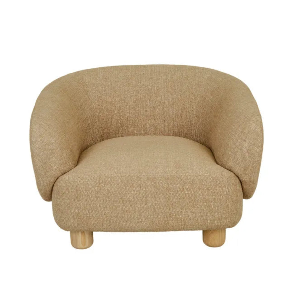 Modern Flo Occasional Chair upholstered in warm hay fabric with ergonomic curved back and four natural ash wooden legs.