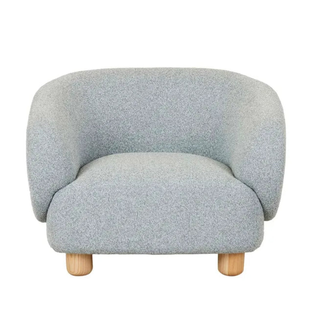 Flo Occasional Chair featuring nimbus textured upholstery and natural ash timber legs with curved barrel design.
