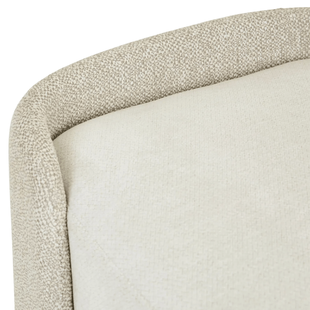 Close-up of a textured fabric surface with a neutral color palette.