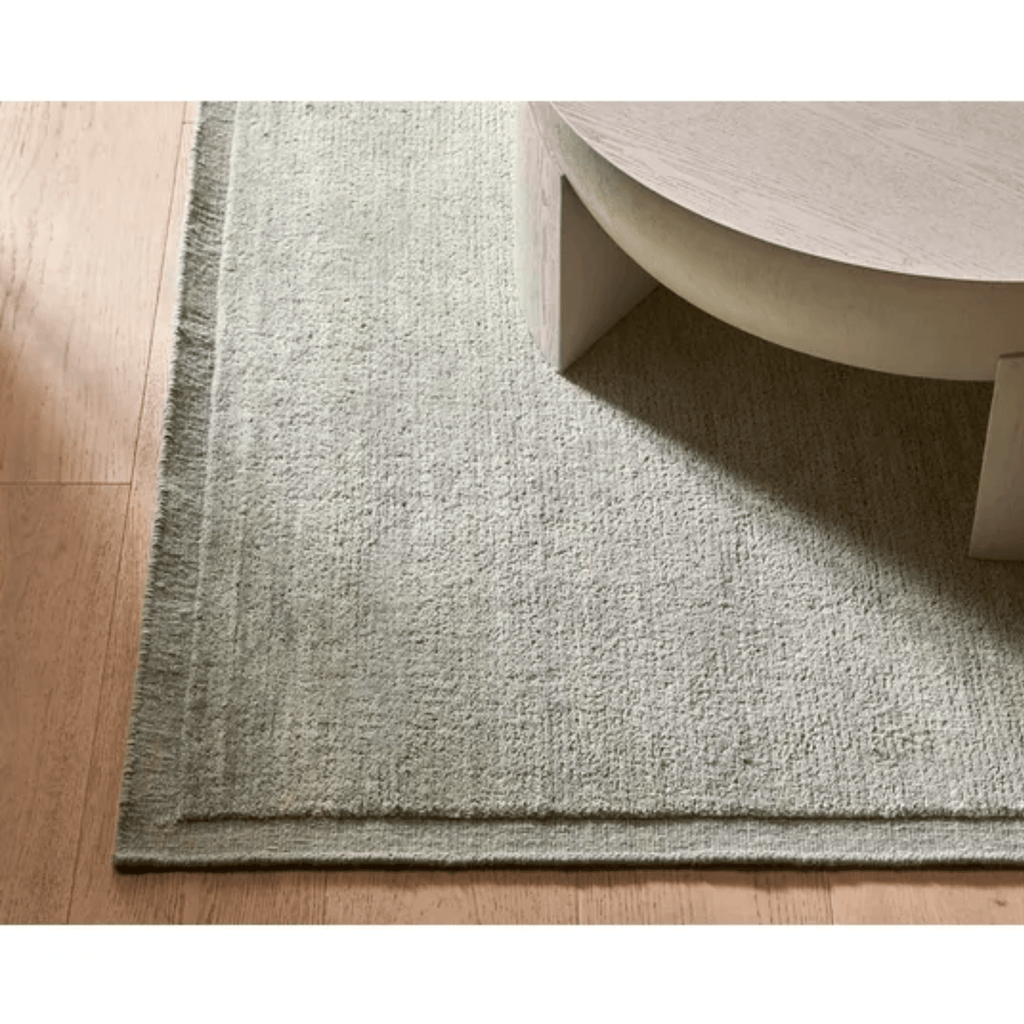 GlobeWest Bower Frame Rug – Seafoam: soft aqua hue with framed wool border—evoking coastal freshness in your space.