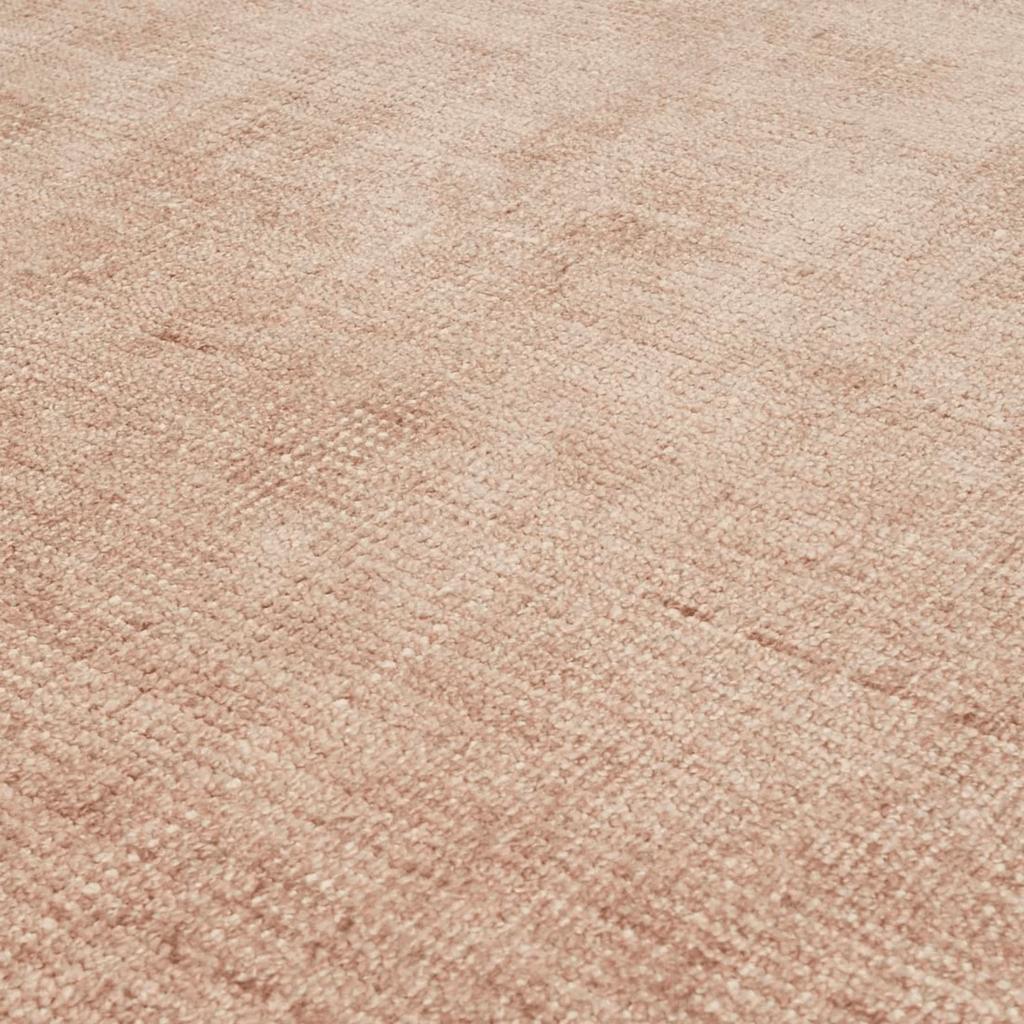 Close-up of Tepih Neptune Rug in Dusty Rose showing wool pile texture and dusty pink hue.