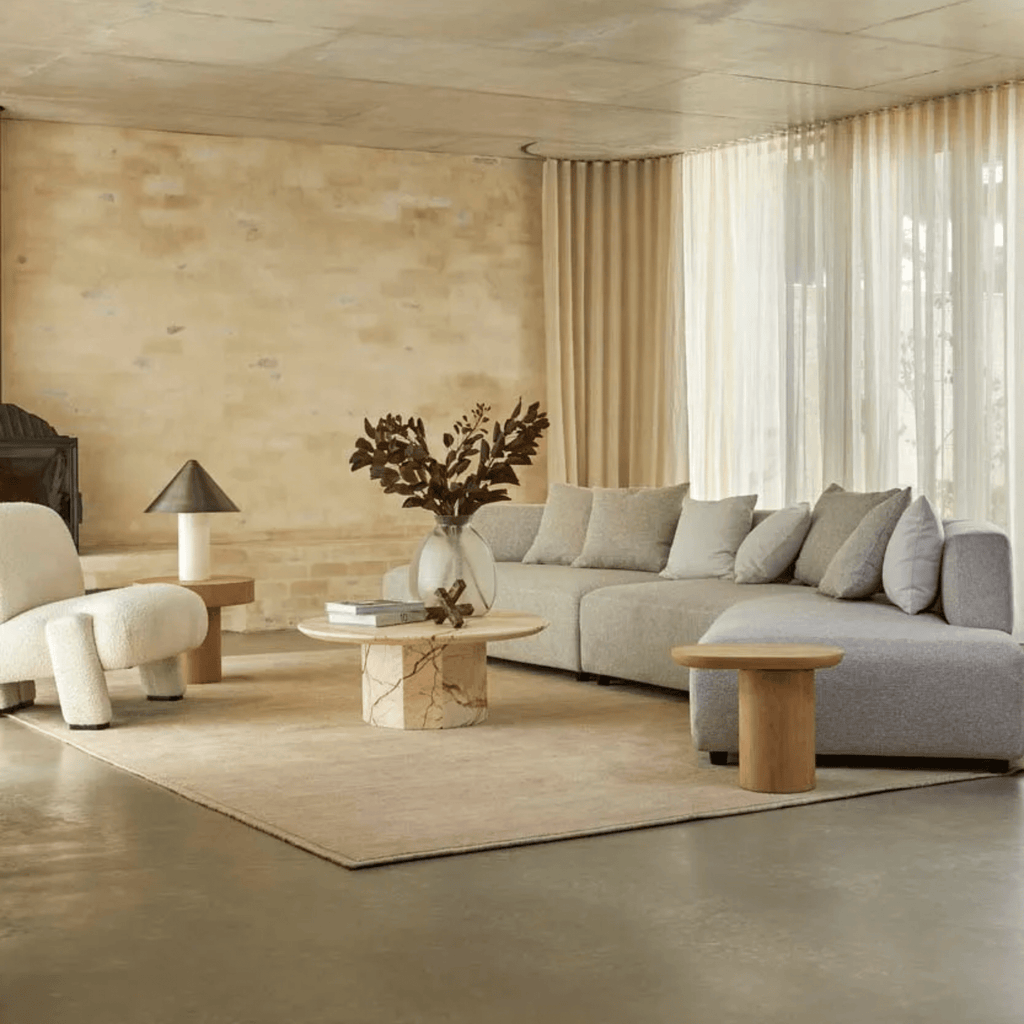 Lifestyle image of modern contemporary living room featuring Seb organic timber side table by globewest as seen on the block 2025