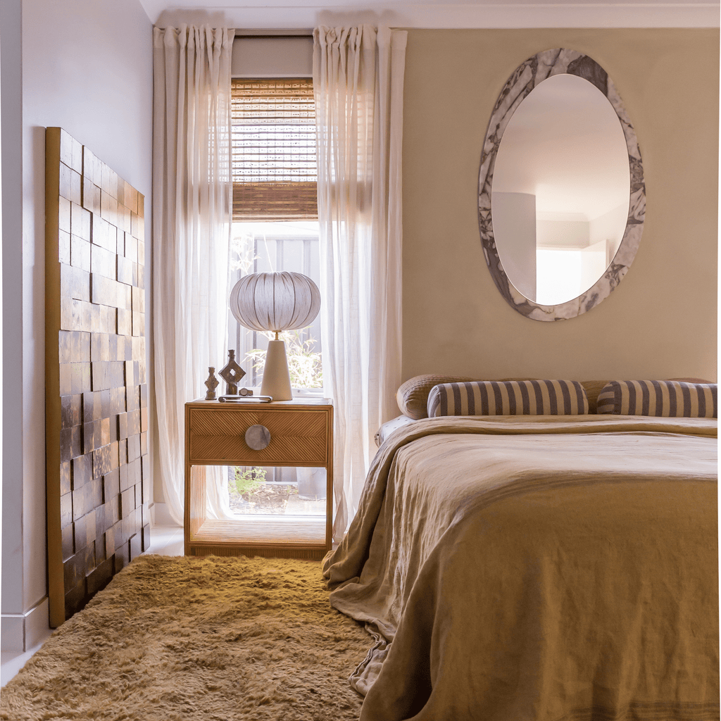 Granite Lane Ora Ocean Marble Mirror Organic mounted vertically to showcase full height and organic shape