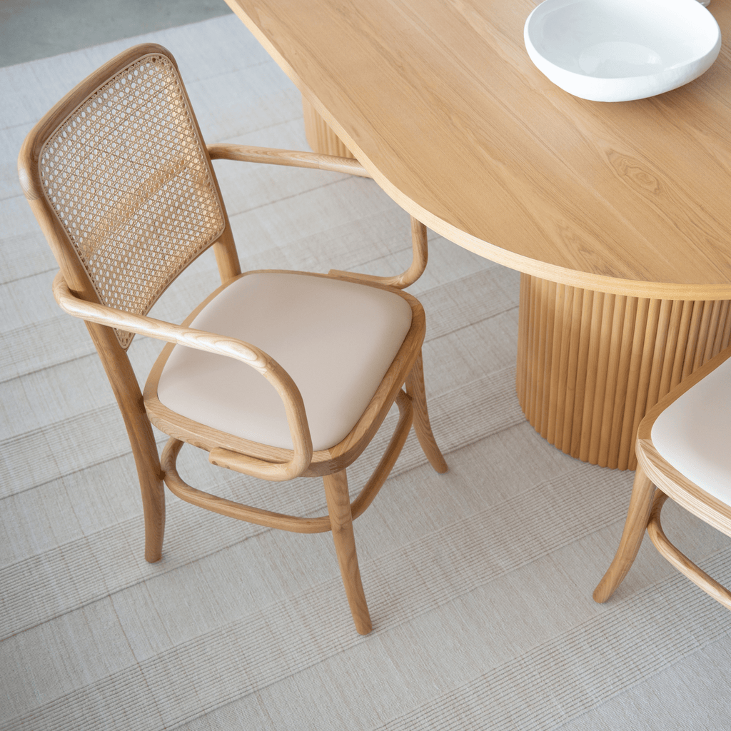 Lacie Dining Chair in nude vegan leather with American ash wood frame and woven rattan backrest