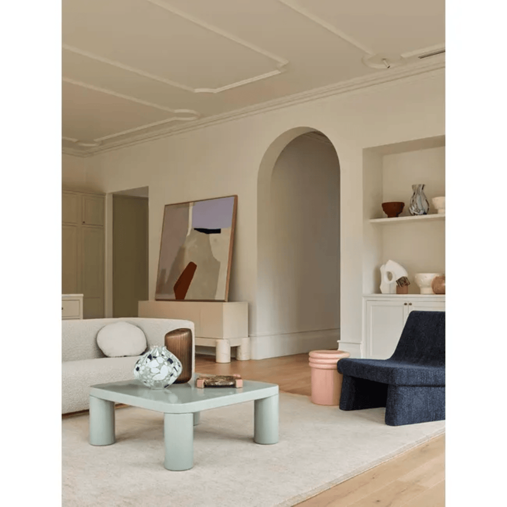 GlobeWest Hanson Round Side Table in dusty rose styled in coastal living room