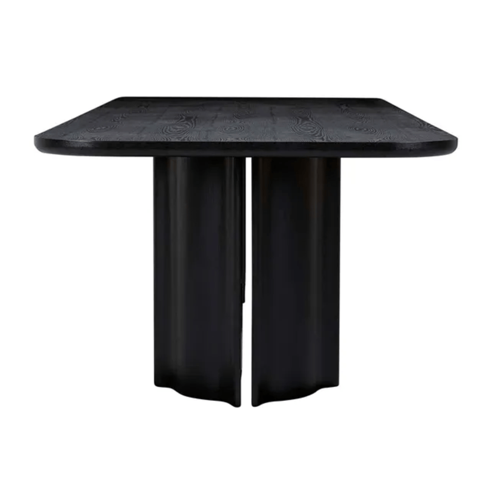 GlobeWest Leon long rectangular dining table in matte black oak veneer, featuring gently rounded corners and bold, fluted cylindrical legs.