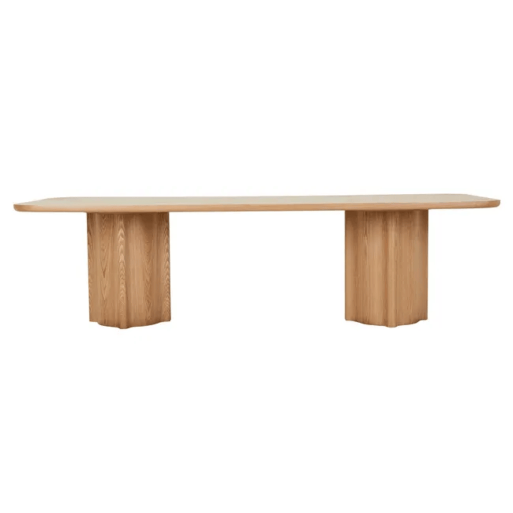 GlobeWest Leon Light ash wood dining table with smooth-profile top and robust vertical fluted legs, showcasing craftsmanship in veneer.