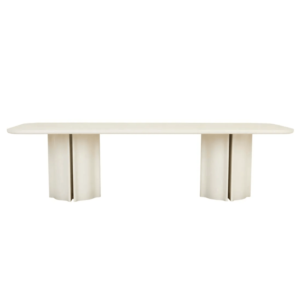 Leon Rectangular dining table in a soft off‑white porcelain veneer, with smooth rounded edges and matching fluted pedestal legs.