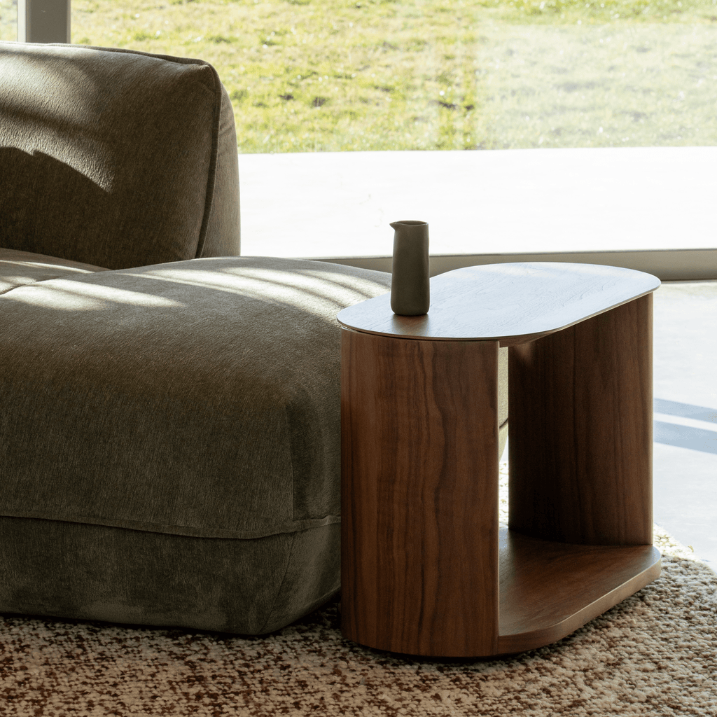 Granite Lane exclusive Meko Walnut Side Table styled in a modern living room with green sofa - can also sit between sofas.
