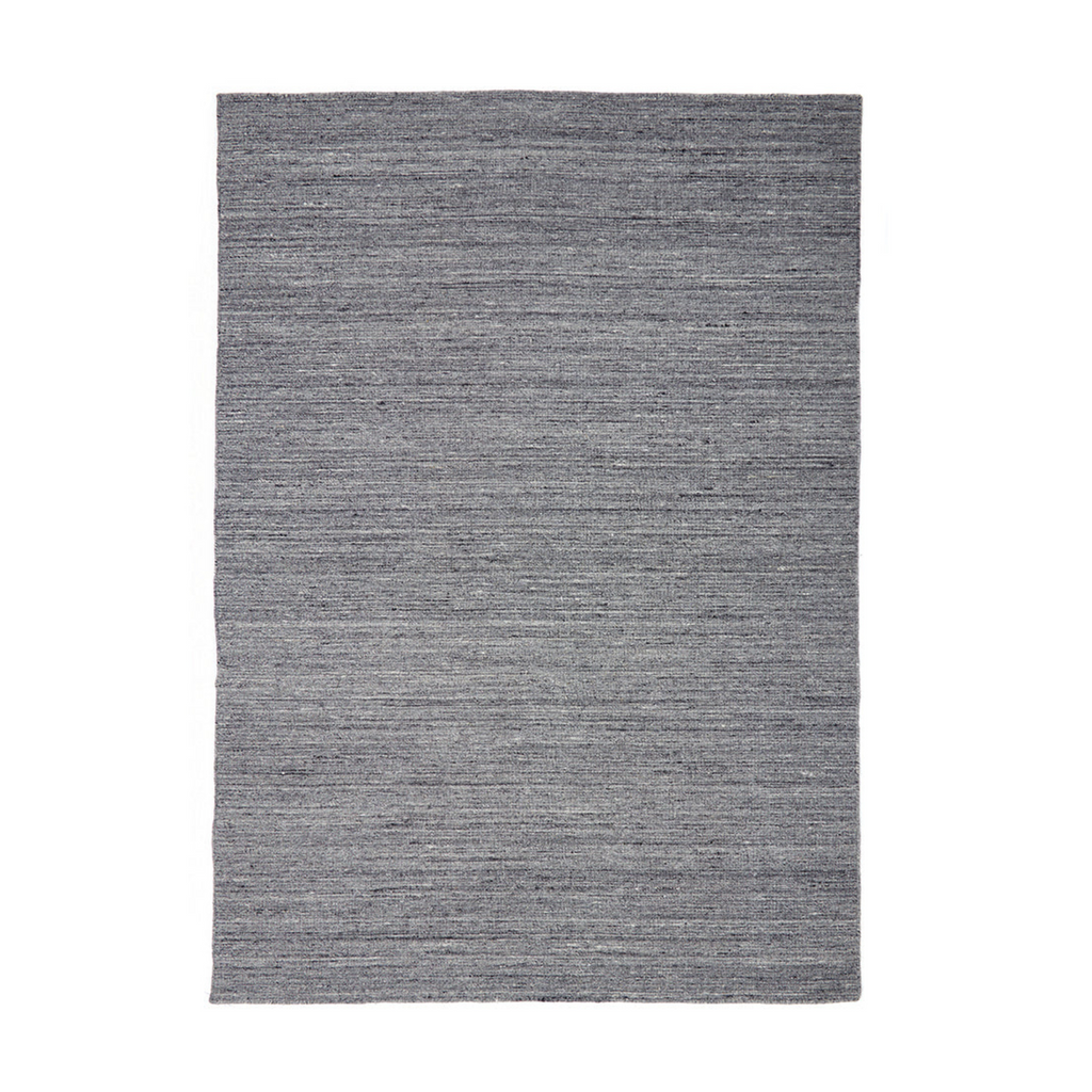 The Morrison rug from Tribe Home, adds a sense of neutrality and balance. Handmade with wool and cotton for longevity and durability. Featured in shades of  multi-coloured greys and hints of ivory.