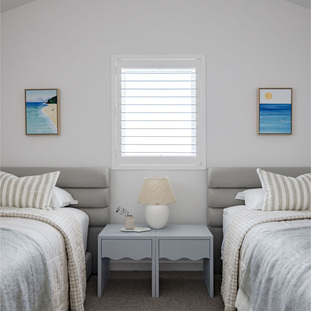 Two matching beds, upholstered scrolls.  Beds that join together, featured with blue bedside wave table