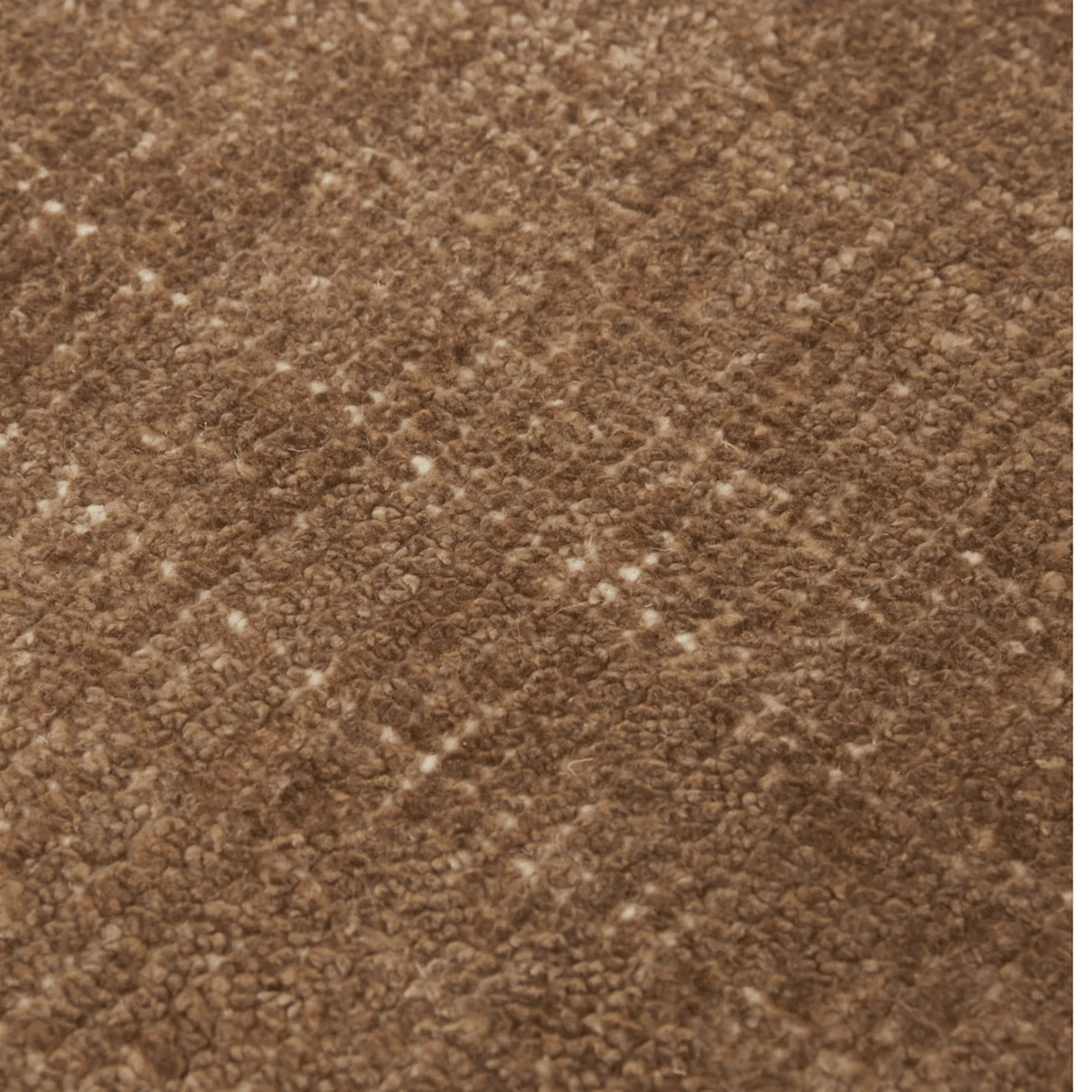 Close-up of Tepih Neptune Rug in Ginger showing soft wool texture and rich ginger hue.