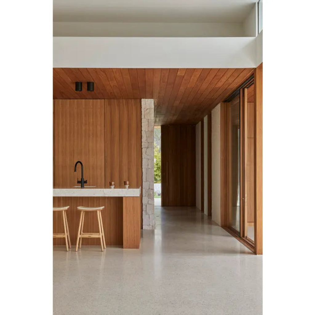 GlobeWest Tolv Odd Upholstered Barstool — Limestone Leather upholstery and Light Oak legs — elegant bar stool.