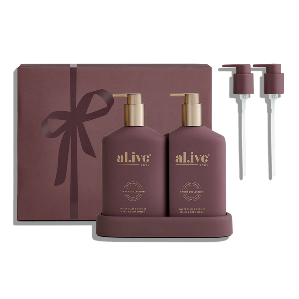 Sweet Plum & Berries 'al.ive' gift set with bottles, pump bottles, and festive packaging.