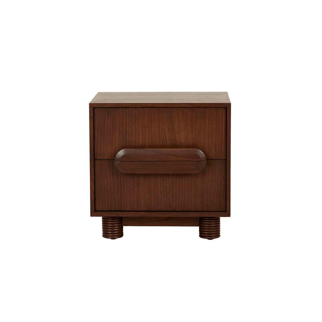 A chestnut‑finished bedside table with a clean, rectangular box shape. It has two drawers with oversized oval wooden handles and stands on four short, rounded legs featuring concentric ring details. The warm brown tone and minimalist design give it a modern yet tactile look.