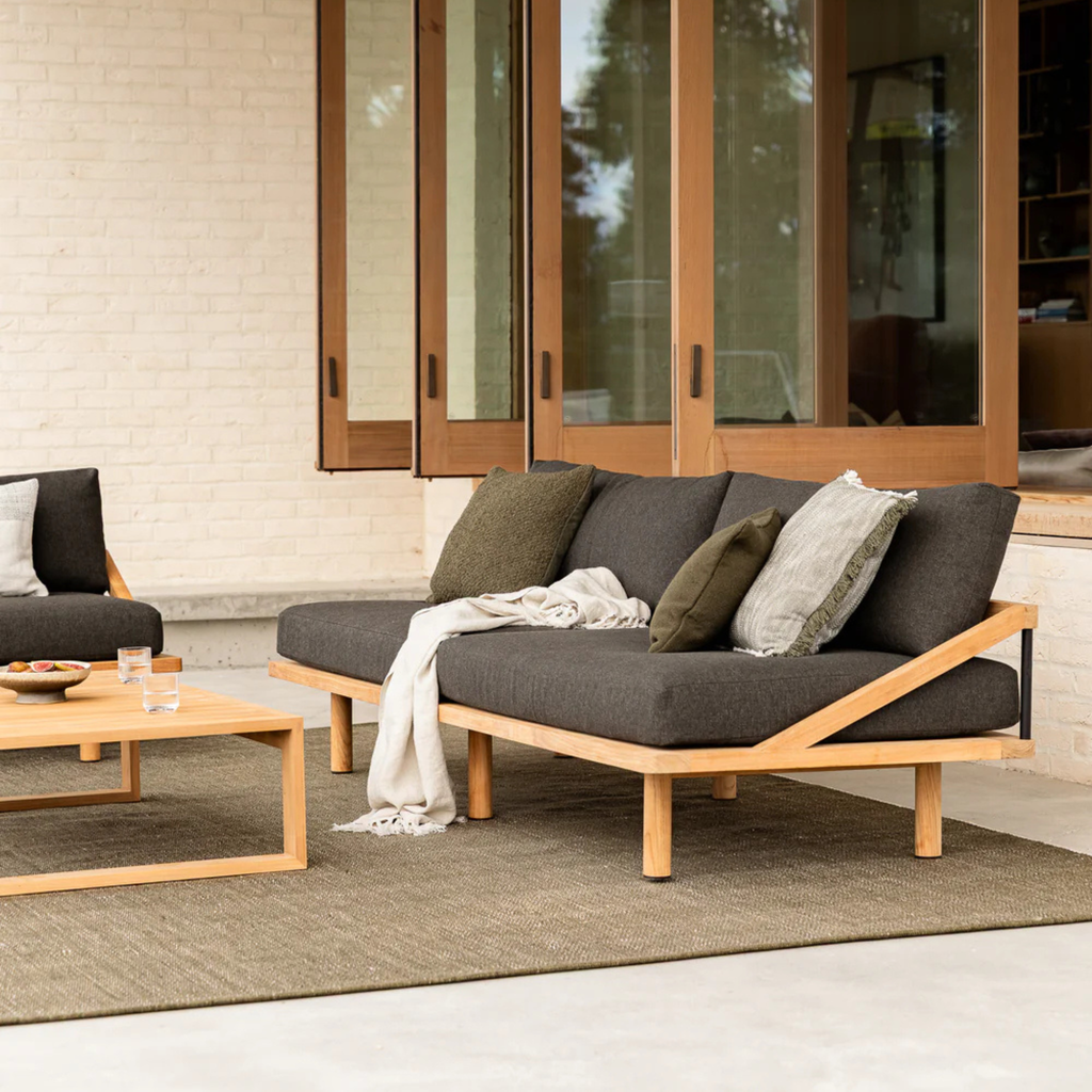 Baya Clipper Cushion Mangrove in outdoor setting adding warmth and natural texture to patio décor