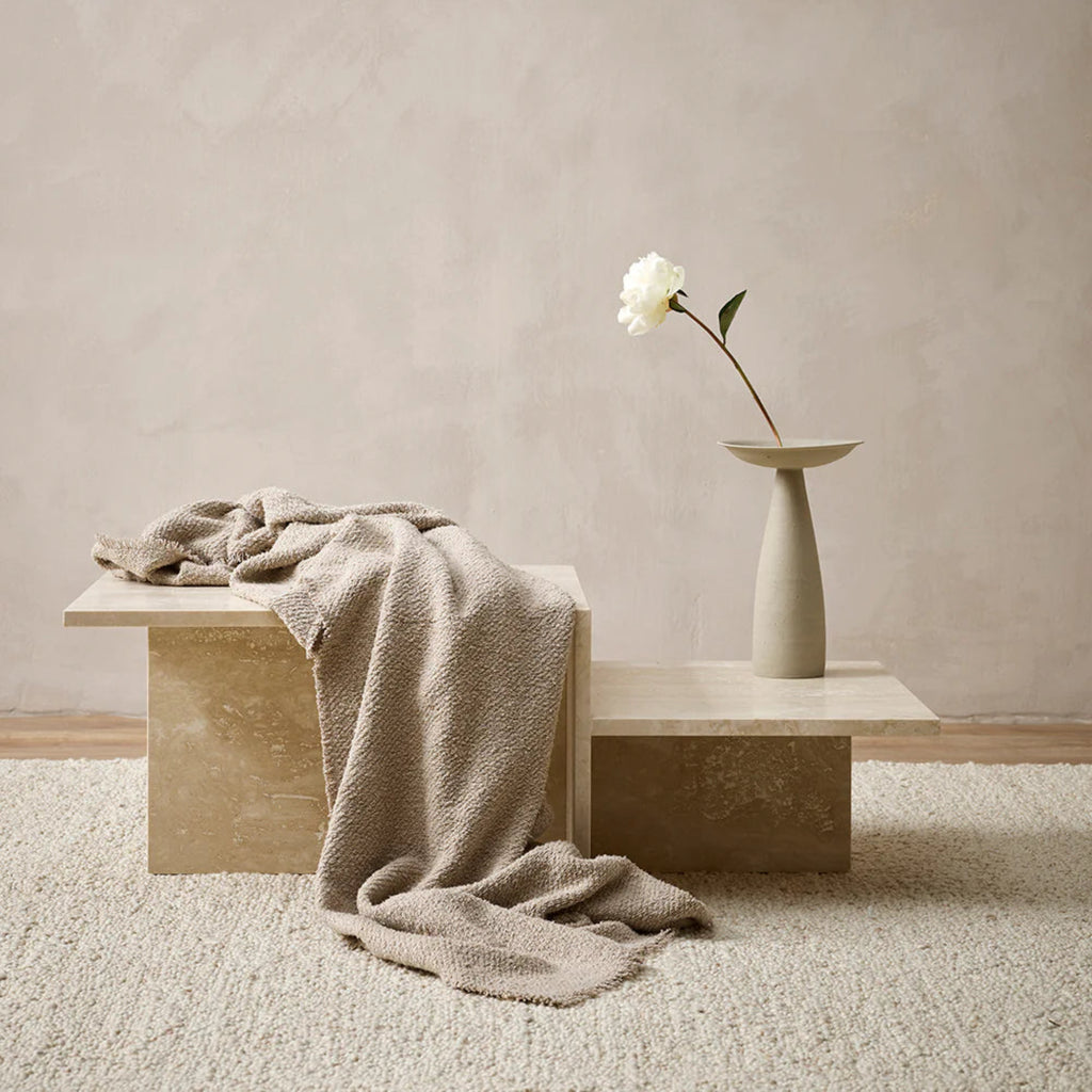 Cromwell Throw rug in taupe.