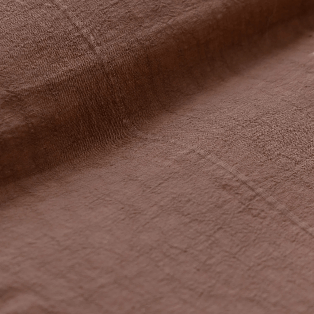 Eadie Luca Linen Bed Cover Clay with matching Luca linen cushions creating cohesive earthy bedroom