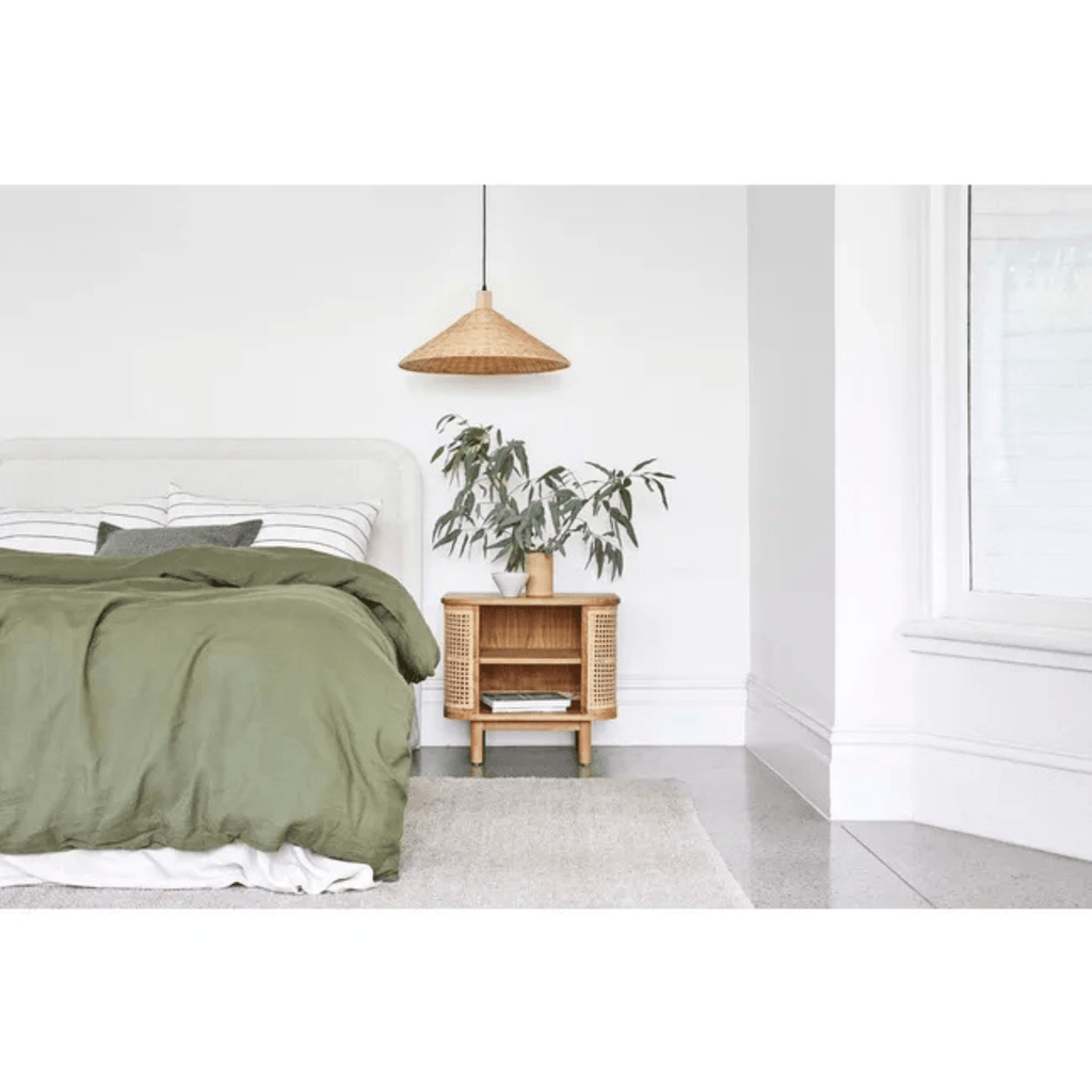 GlobeWest Hugo Bedhead in Natural Speckle styled in a contemporary bedroom with soft neutral tones, layered bedding, and modern bedside furniture — showcasing its vertical panelling and plush upholstery