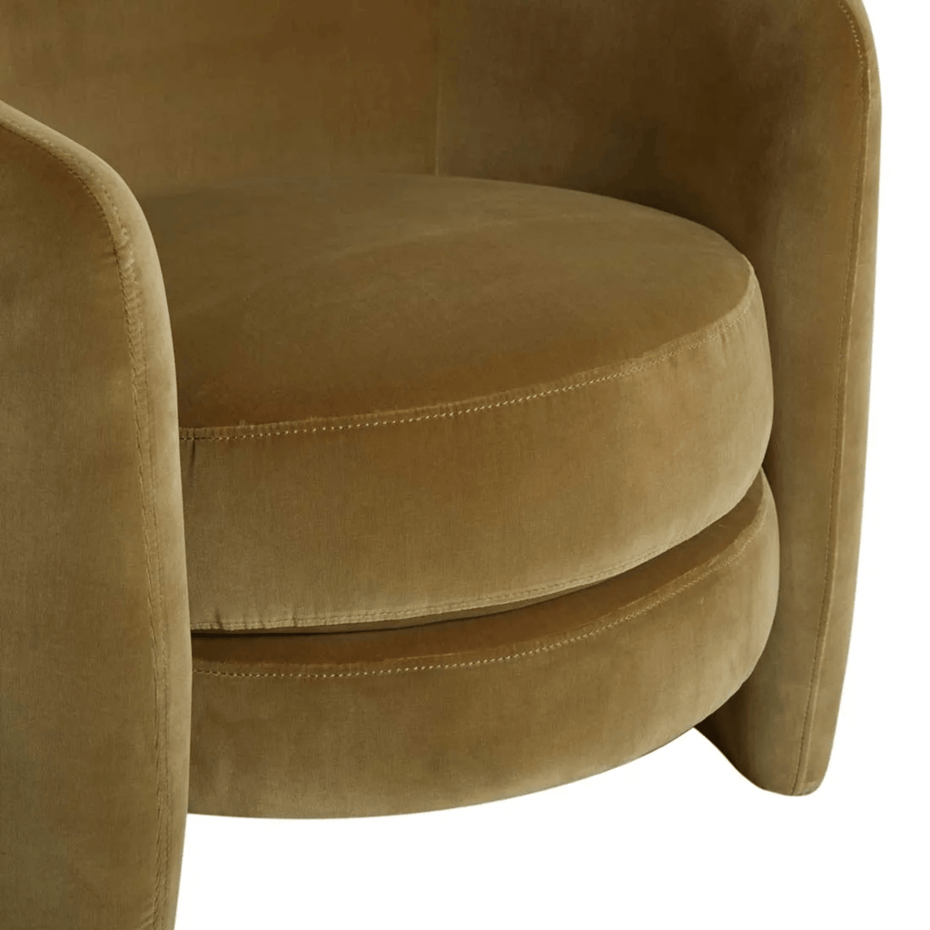 Close-up of soft moss velvet upholstery on Kennedy Tenner chair, showcasing plush texture and fine stitching detail.