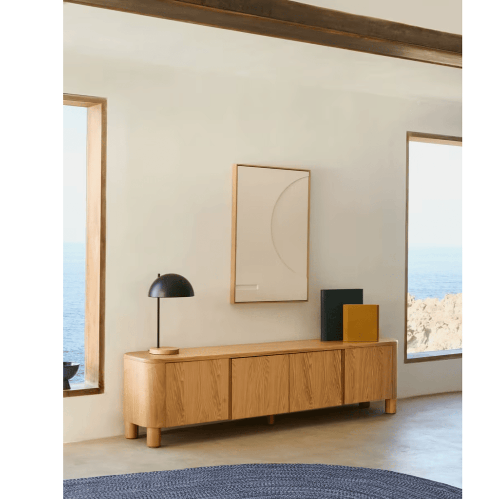 Laylah Entertainment Unit in a room with large windows and abstract art on the wall.