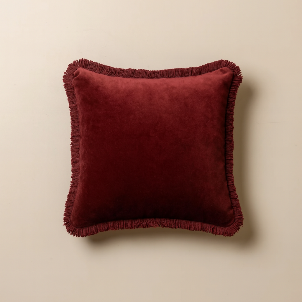 Saarde Home Velvet Fringe cushion with rich burgundy hue